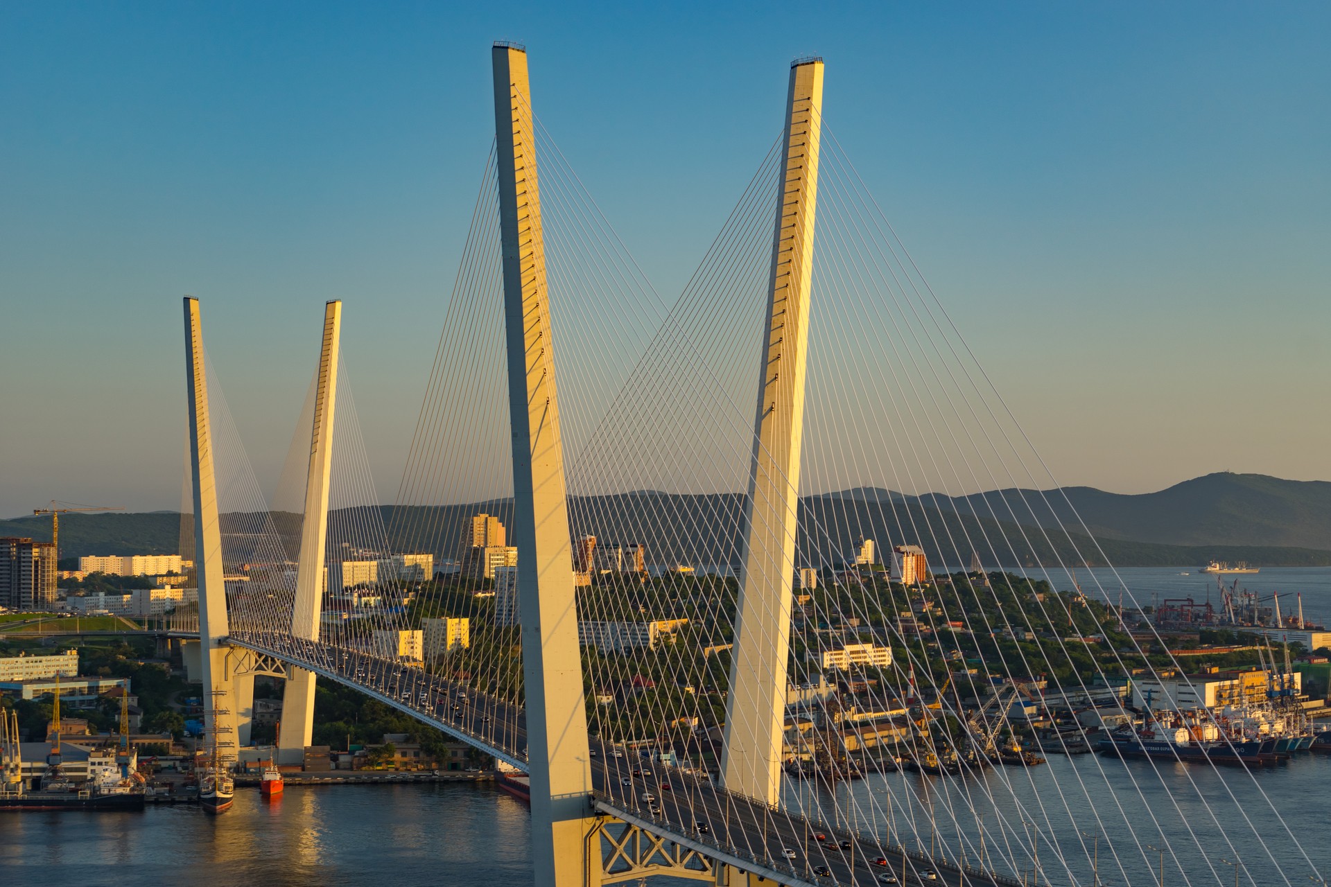 Golden bridge is a landmark of the city at sunset.